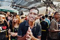 KO SAMUI, THAILAND - APRIL 13: Unidentified man in a thai pose of sawadee krap on Songkran Festival