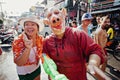 KO SAMUI, THAILAND - APRIL 13: Unidentified thai girl and man with a pig mask posing on Songkran Festival