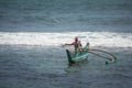 KOATTAGODA, SRI LANKA: Sinhalese fishermen in traditional outrigger canoe Royalty Free Stock Photo