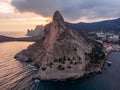 Koba-kaya mountain in sea in Crimea, large rock at beautiful sunset and seascape nature landscape, aerial panoramic view Royalty Free Stock Photo