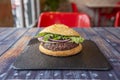 Kobe beef burger cooked to the point with raw red onion, Manchego cheese Royalty Free Stock Photo