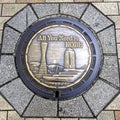 Close up picture of a beautifully decorated Manhole of Kobe City, Japan