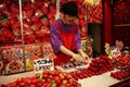 KOBE, JAPAN - MARCH 30, 2019: Sale strawberries in sweet glaze in Chinatown district of Kobe