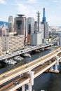 Kobe skyline from above with port and elevated road portrait format in Japan