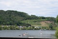 Koblenz, Germany - 06 25 2020: cargo ships passing the freetime boats on the Mosel