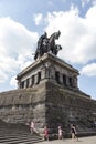 A woman with children passes near the monument to Kaiser Wilhelm I in Koblenz.