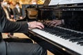 19.03.2021 Koblenz Germany - Male Hand playing on schimmel piano at party Event dinner Close-up Small depth of field