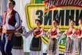 Young men and girls dancing Serbian traditional national folk dance Kolo Royalty Free Stock Photo