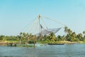 Chinese fishing nets and a fisherman in Cochin Kochi India, ba