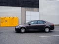 Koda Octavia car in front of yellow Amazon Locker