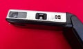 Kodak Instamatic camera lying on red background Royalty Free Stock Photo