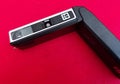 Kodak Instamatic X-15 Camera lying on red background Royalty Free Stock Photo