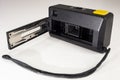 KODAK pocket camera A-1. Back of a black analog camera with yellow shutter release and black strap Royalty Free Stock Photo