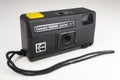 KODAK pocket A-1 camera with its case. Black analog camera with yellow trigger. White background Royalty Free Stock Photo
