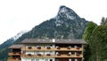 The Kofel Mountain Peak and Typical Bavarian Hotel in Oberammergau Germany.