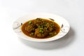 Kofta Curry, Delicious Meat Balls in thick spicy gravy in plate on white background Royalty Free Stock Photo