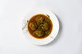 Kofta Curry, Delicious Meat Balls in thick spicy gravy in plate on white background Royalty Free Stock Photo