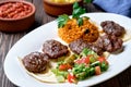 Kofte kefte - Turkish cutlets meat balls made from lamb and beef meat and spices, cooked over charcoal. Served on a platter Royalty Free Stock Photo