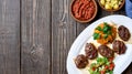 Kofte kefte - Turkish cutlets meat balls made from lamb and beef meat and spices, cooked over charcoal. Served on a platter Royalty Free Stock Photo