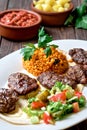 Kofte kefte - Turkish cutlets meat balls made from lamb and beef meat and spices, cooked over charcoal. Served on a platter Royalty Free Stock Photo