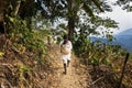 Kogi family walking in a trail in the forest in the Sierra Nevada de Santa Marta, Nevada