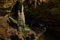 Koh-i-noor stalagmite in St. Beatus Cave and waterfalls above Th