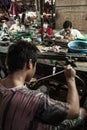 Khmer goldsmith creates necklace and accessories at a gold workshop