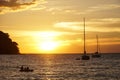 Koh kood beach thailand, sunset boat orange sky people on boat, kayaking silhouette Royalty Free Stock Photo