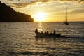 Koh kood beach thailand, sunset boat orange sky people on boat, kayaking silhouette Royalty Free Stock Photo