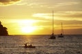 Koh kood beach thailand, sunset boat orange sky people on boat, kayaking silhouette Royalty Free Stock Photo