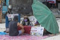 Asian Tarot reader or Fortune teller of hands holding up tarot card and predicts the future for the European tourist, Koh Phangan