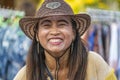 Portrait happy woman in straw hat on the street market at tropical island Koh Phangan, Thailand