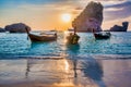 Koh Phi Phi Don with anchored long tail boats at sunset, Thailand. Vacation, travel and holiday concept Royalty Free Stock Photo