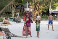 Koh Rong island, Cambodia - 6 April 2018: mother and child khmer selling fruits on beach. Tourist industry opportunities