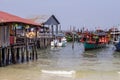 Koh Rong island, Cambodia - April 7, 2018: Seaside view with rustic house on piles and wood boats