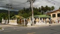 KOH SAMUI ISLAND, THAILAND - 24 JUNE 2019 Deserted road with spirit houses in Thai style. Typical countryside road with shop of