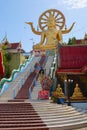 Tourists visit Big Buddha statue in Wat Phra Yai Temple at Koh Samui island, Thailand. Royalty Free Stock Photo