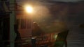 KOH TAO ISLAND, THAILAND - 30 JUNE 2019: Adult Thai man sitting on deck of traditional fisherman or diving boat and smoking at