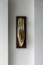 Open palm hand decorative modern art sculpture on white wall in home