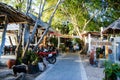 KOH TAO, THAILAND, Island life. A pedestrian street along the coast of Sayri beach is sometimes used by motorcycles Royalty Free Stock Photo