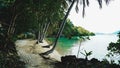 Tropical white sand beach with coco palms and the turquoise sea at Koh Wai Island, Thailand Royalty Free Stock Photo