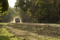 tourist safari vehicle moves along the unpaved road