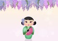 Kokeshi doll and wisteria flowers