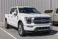 Ford F-150 display at a dealership. The Ford F150 is available in XL, XLT, Lariat, King Ranch, Platinum, and Limited models Royalty Free Stock Photo