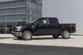 Ford F-150 display at a dealership. The Ford F150 is available in XL, XLT, Lariat, King Ranch, Platinum, and Limited models Royalty Free Stock Photo