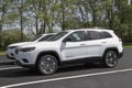 Jeep Cherokee display at a dealership. Jeep offers the Cherokee in Altitude, Trailhawk and Limited models