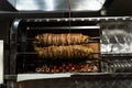 Kokorech lamb intestines roasting in Turkish market. Traditional street food.