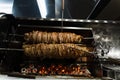 Kokorech lamb intestines roasting in Turkish market. Traditional street food.