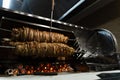 Kokorech lamb intestines roasting in Turkish market. Traditional street food.