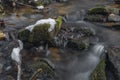 Kokotinsky dick creek with green moss stone in winter cold day Royalty Free Stock Photo